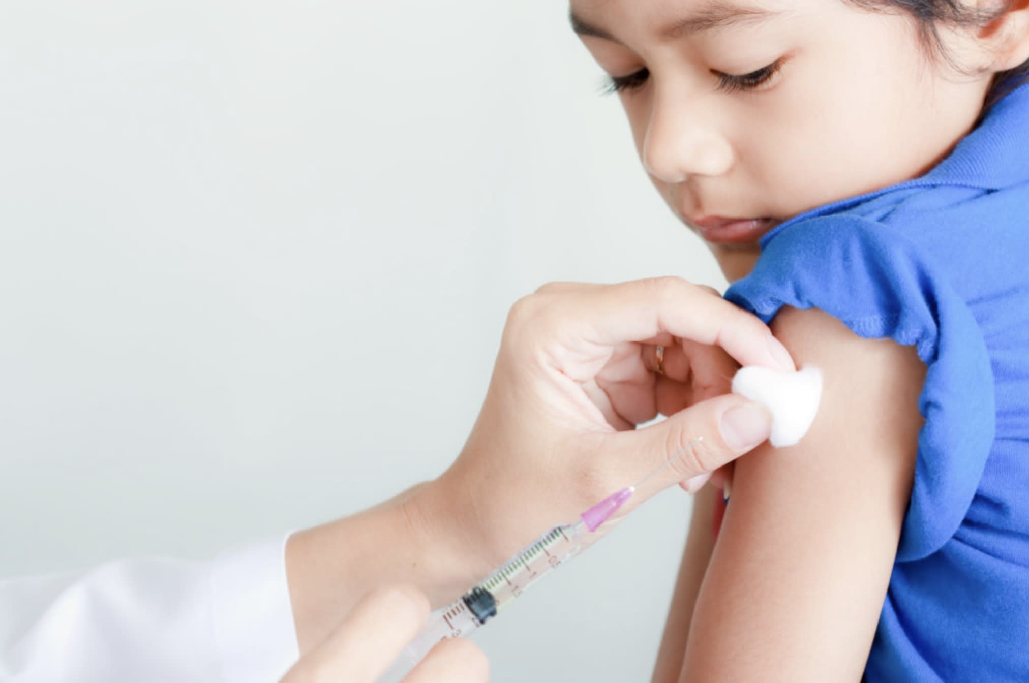 A girl getting vaccination