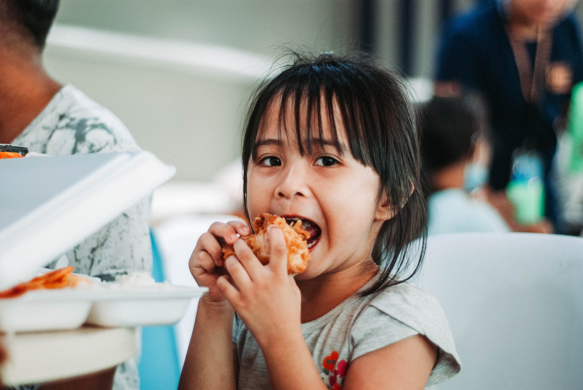 Person feeding children