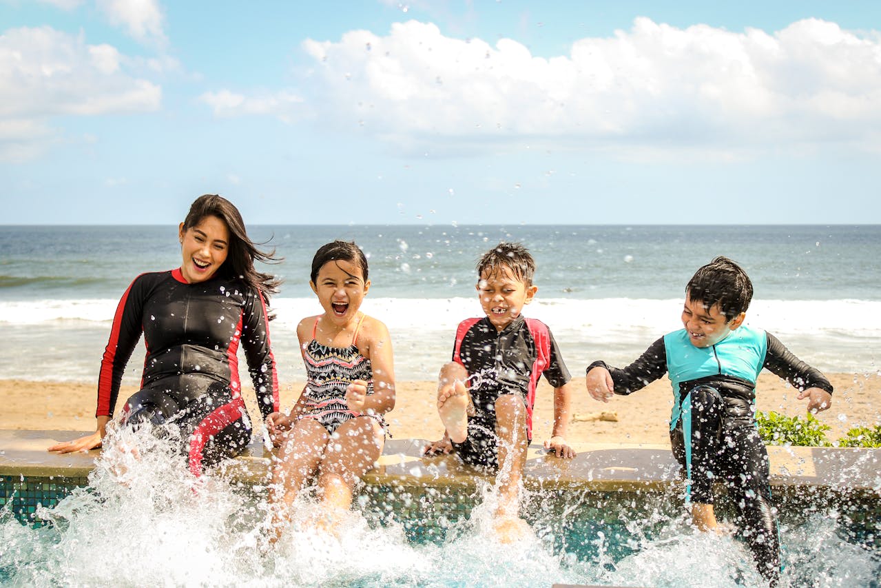 Woman swimming with children