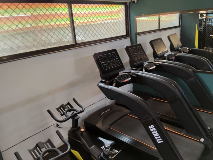 Cardio area with treadmills and exercise bikes