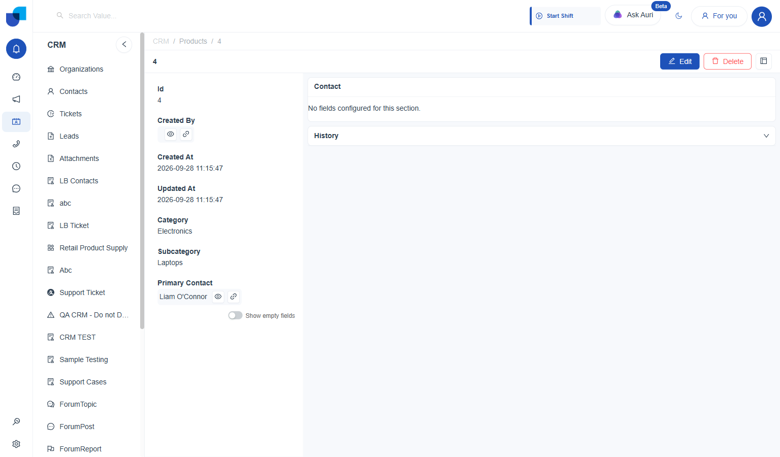 Products record detail page showing Id, Created By, Created At, Updated At, Category, Subcategory, and Primary Contact fields, with Edit and Delete buttons at the top right, and a Contact section and History panel on the right