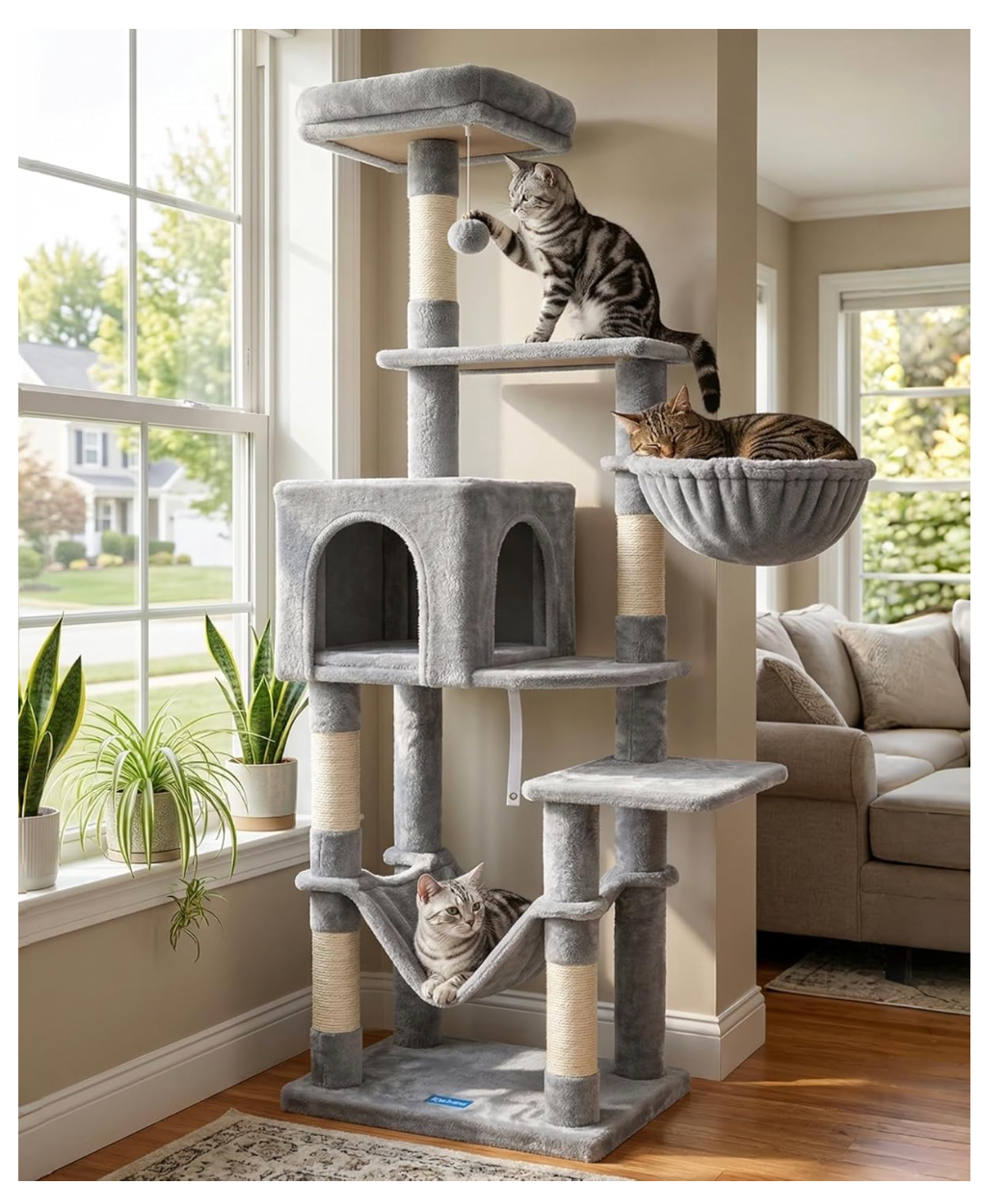 Grey multi-level cat tree with scratching posts and platforms in a bright living room