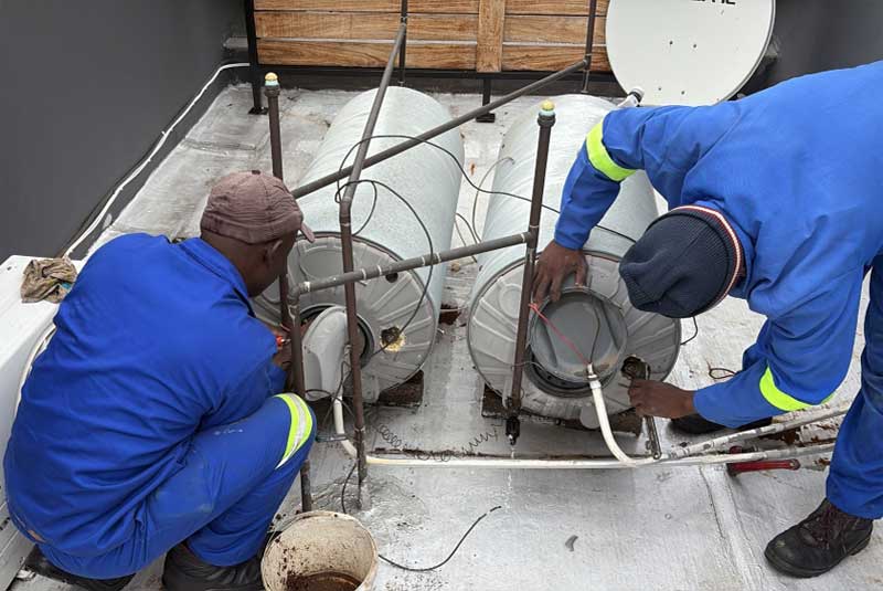 Bestcare plumber fitting a pipe fixture in a Nairobi home