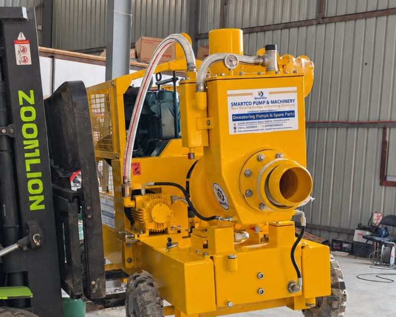 SmartCo dewatering pump lifted by a forklift in the warehouse