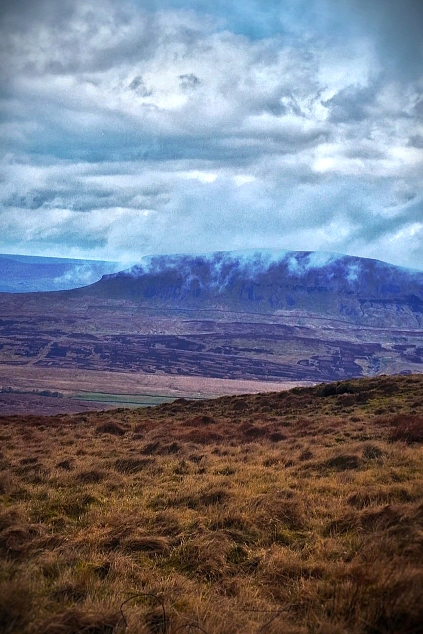 Cloud rolling across the fells above Malham