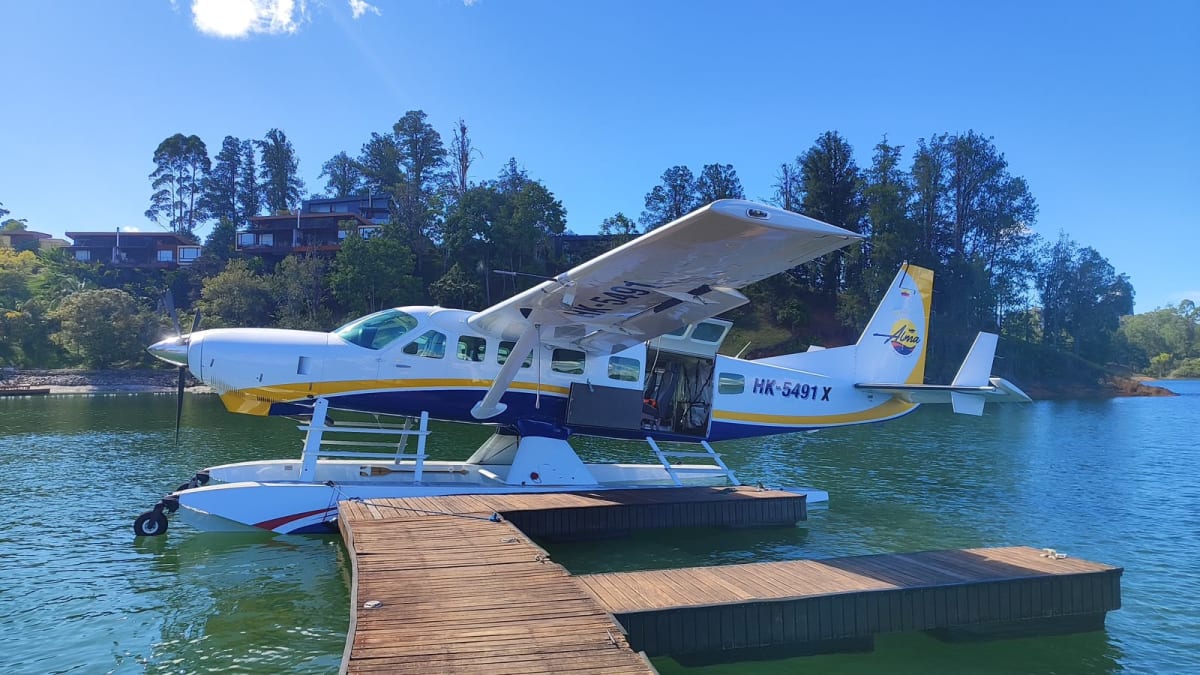 Alma Air charter seaplane docked on Guatapé Lake after the flight from Medellín