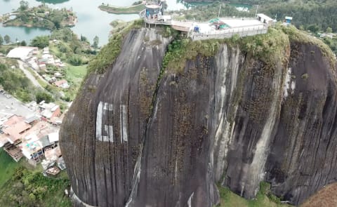 Aerial view of El Peñol rock and its summit viewpoint above Guatapé Lake