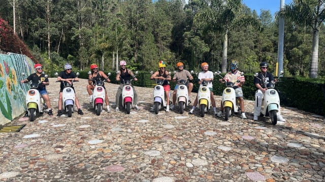 Group on electric scooters ready to ride through Guatapé