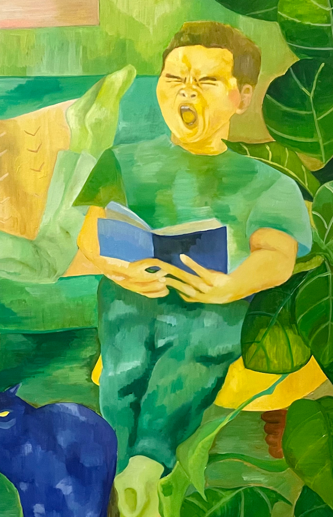 A reading woman and a yawning boy