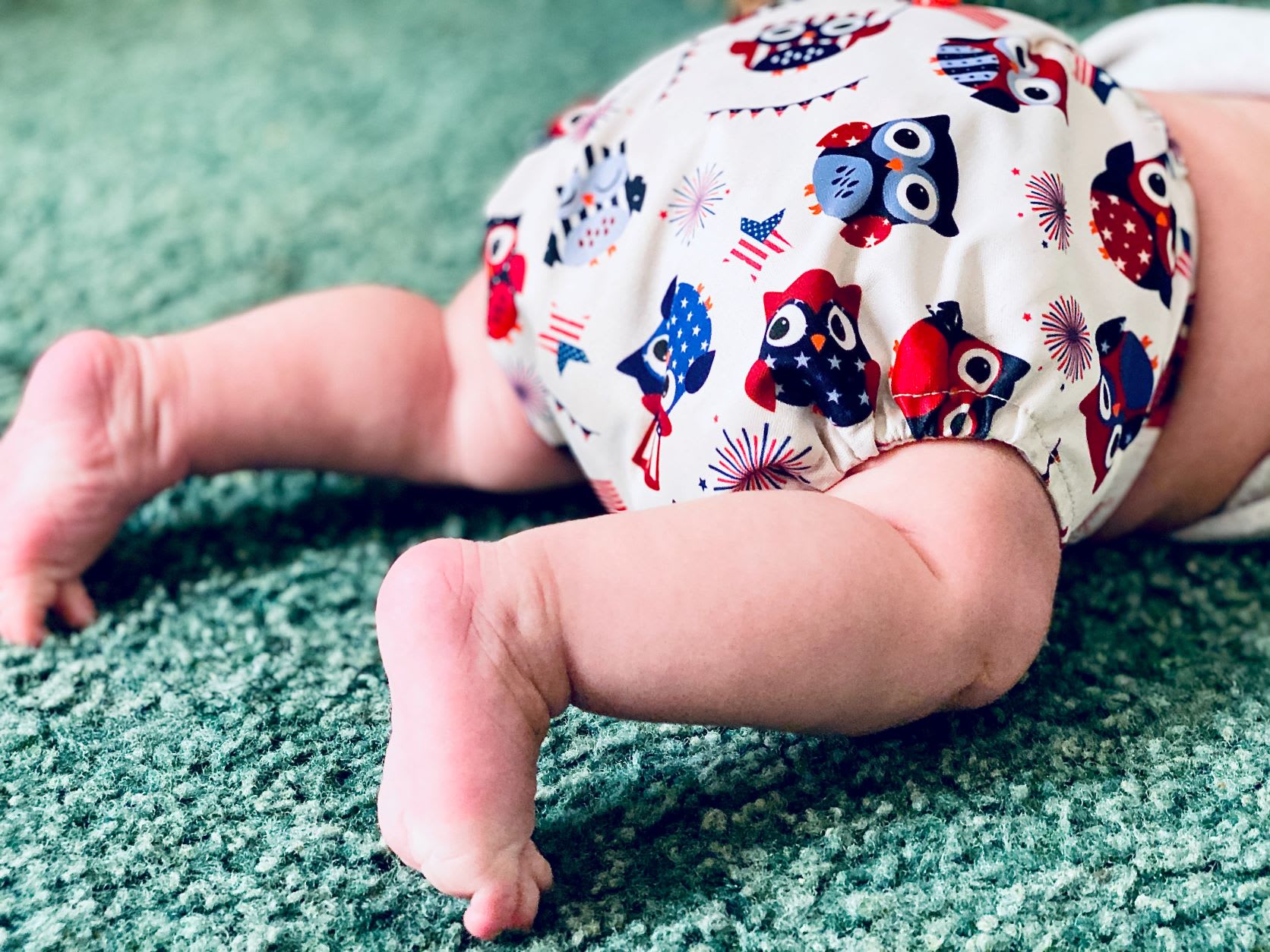 A baby wearing a reusable nappy