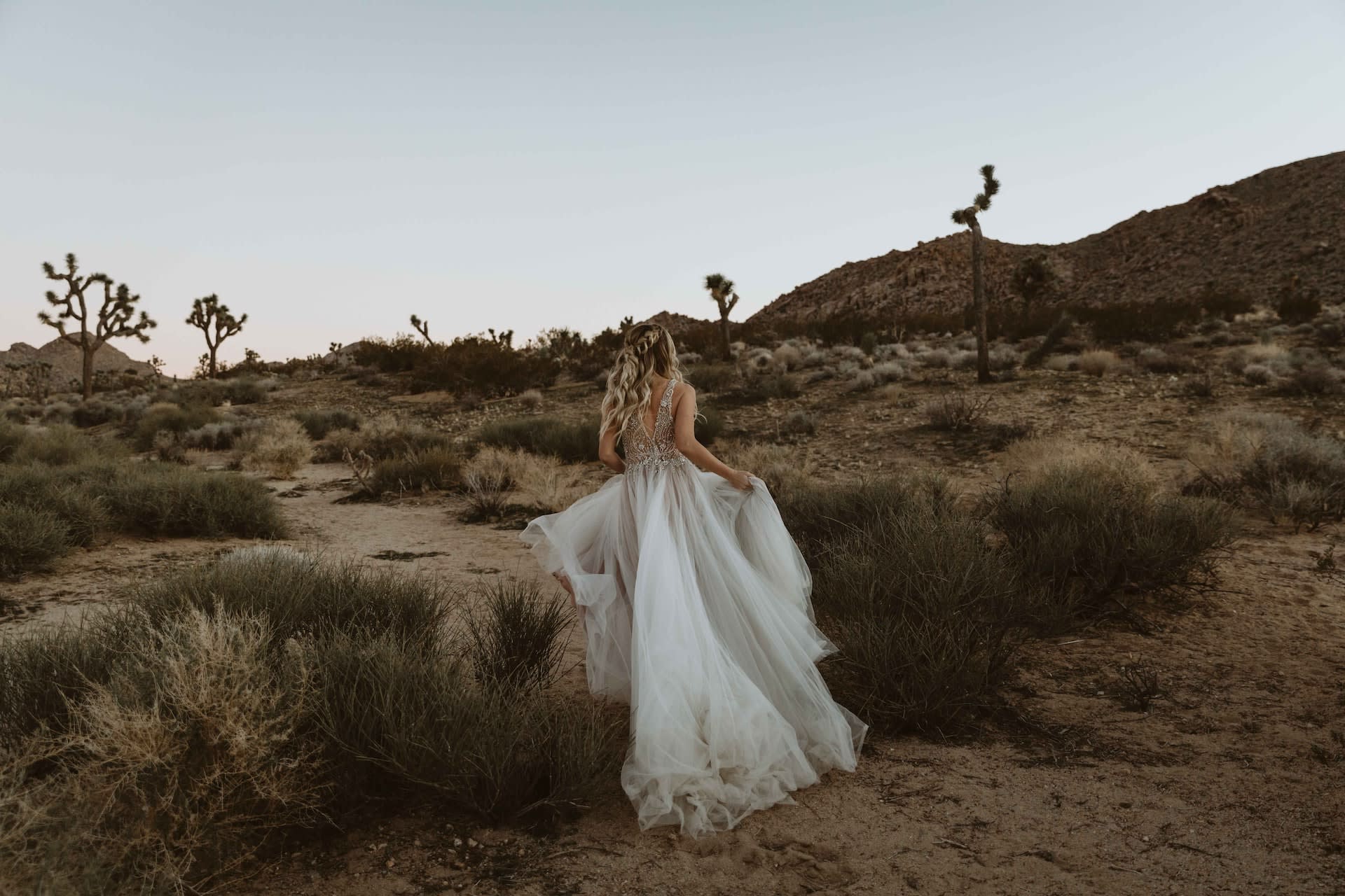 Bride wearing an elegant second-hand tulle wedding dress