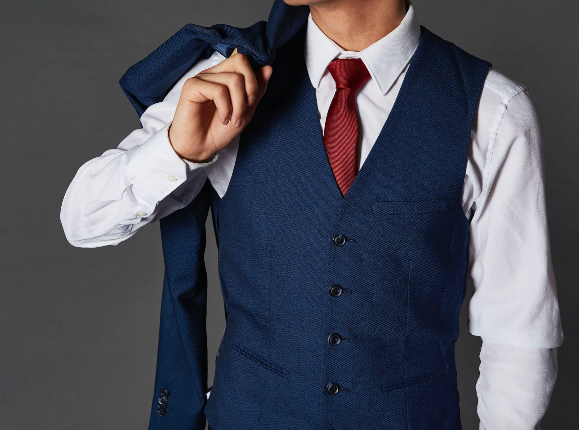 Man wearing blue second-hand suit waistcoat