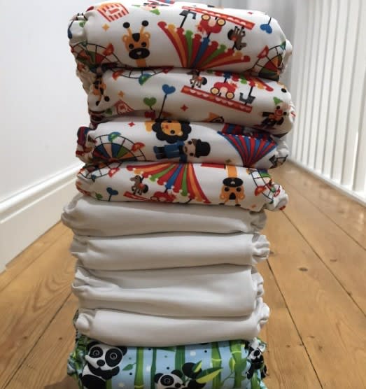 A stack of folded reusable nappies