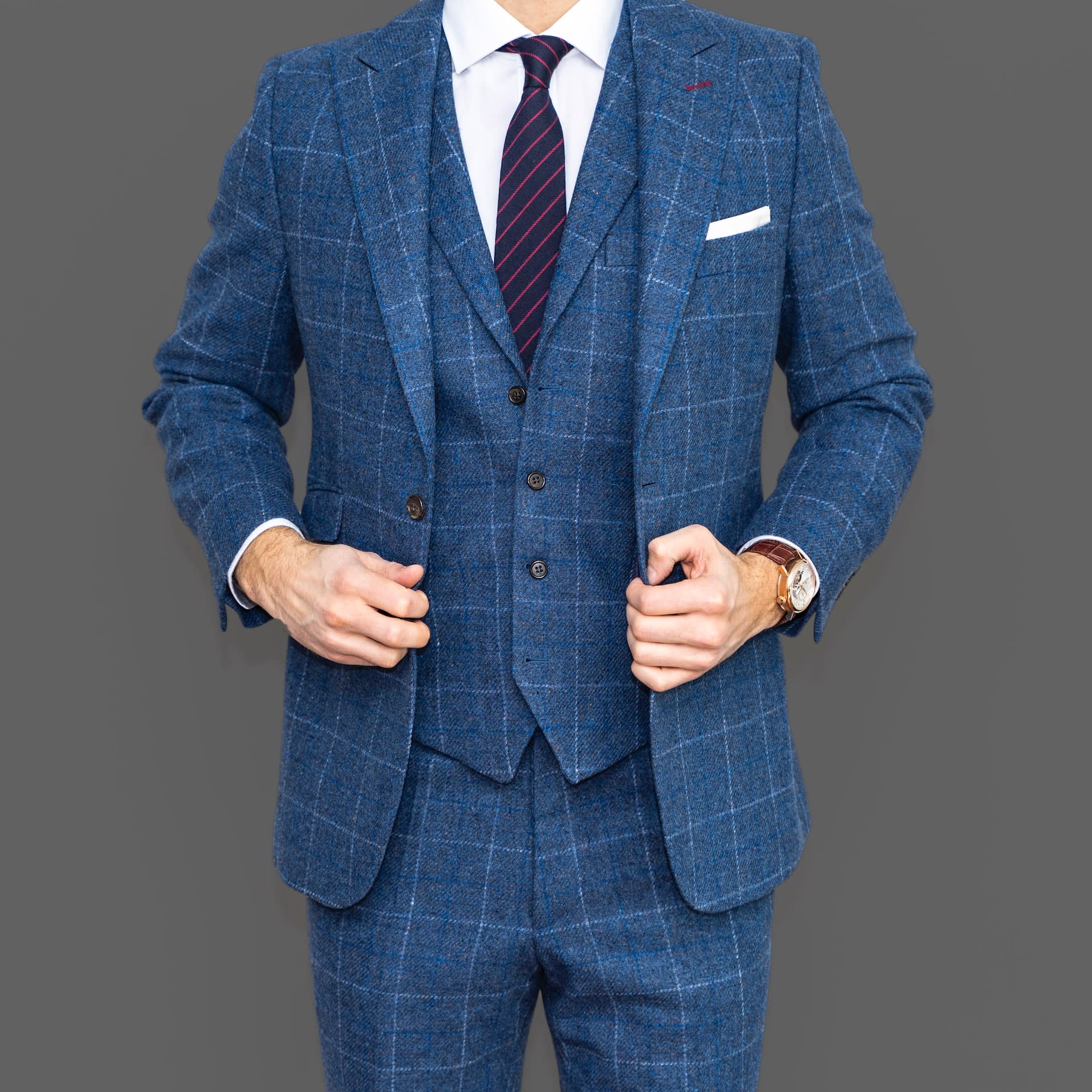 Man wearing a blue check 3 piece suit