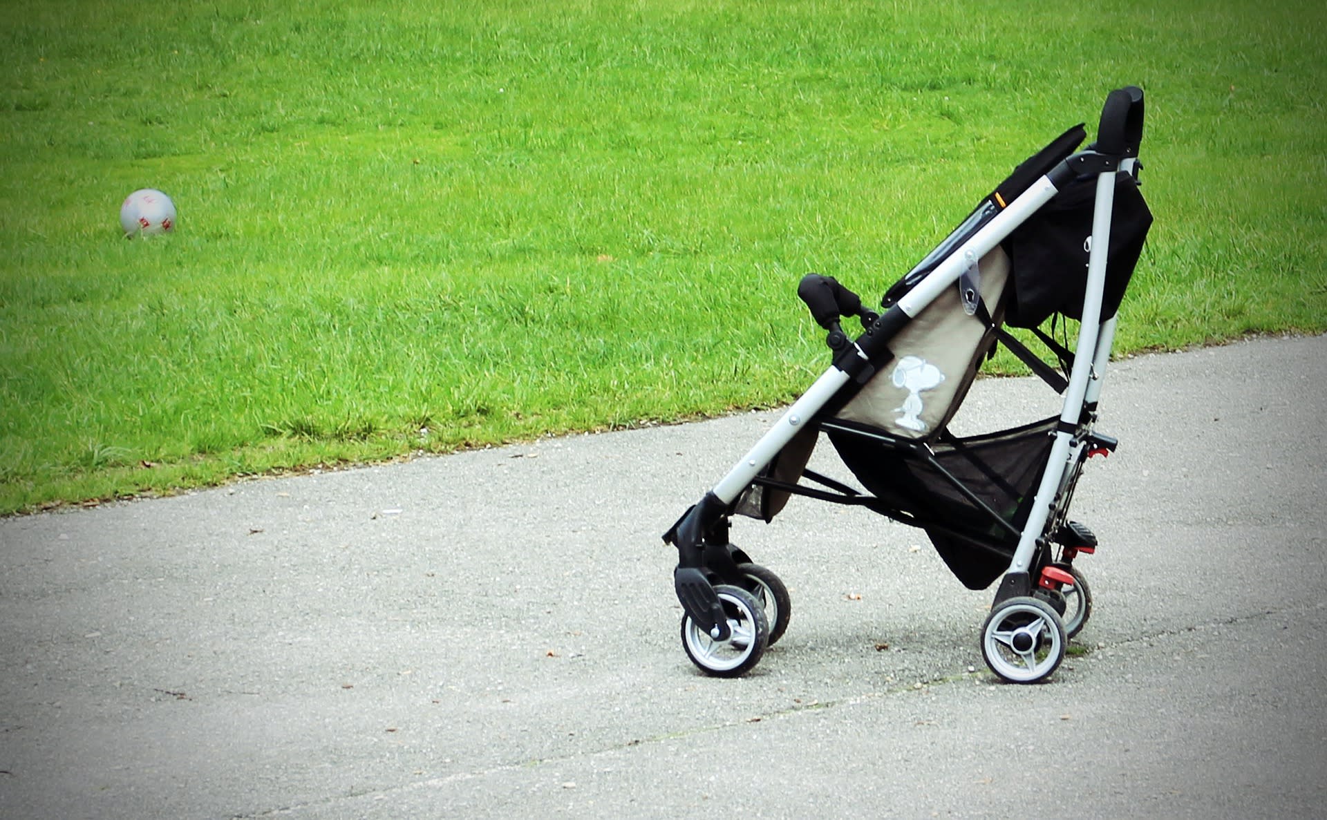 A baby stroller in a park