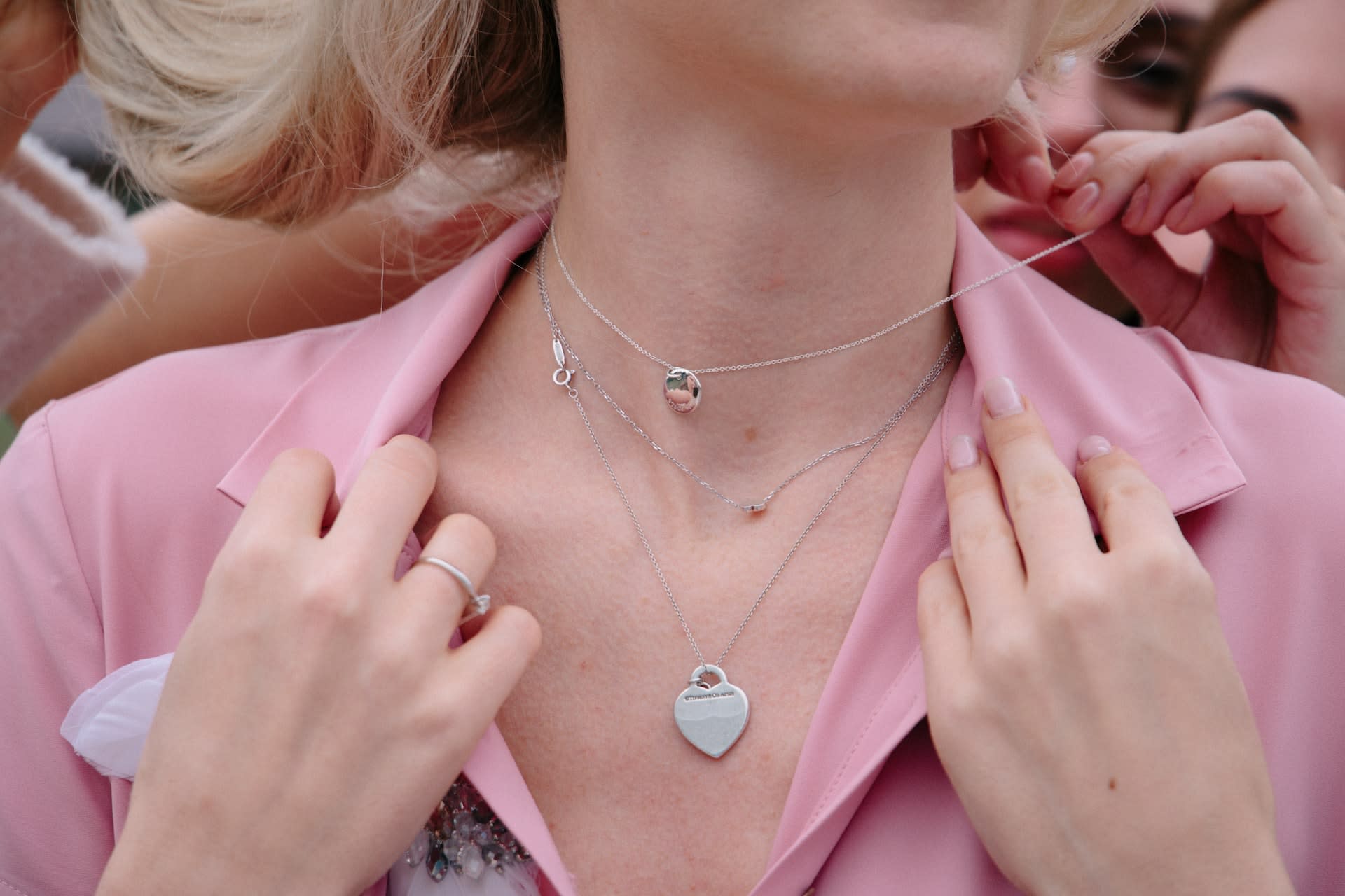 Woman wearing vintage layered silver necklaces