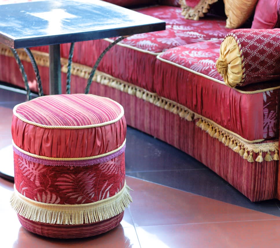 Luxurious red and gold vintage footstool