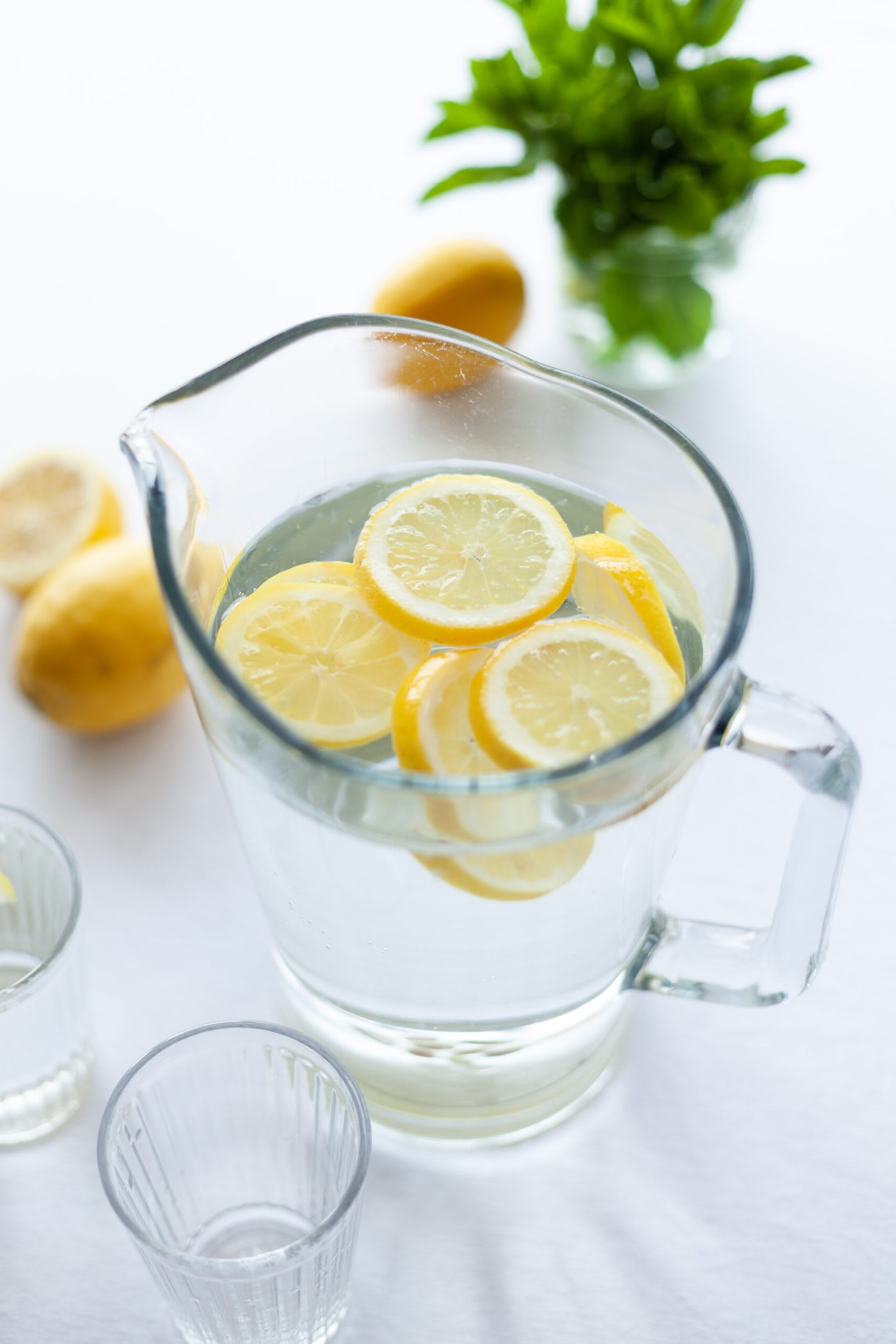 Pitcher jug with ice water and lemon