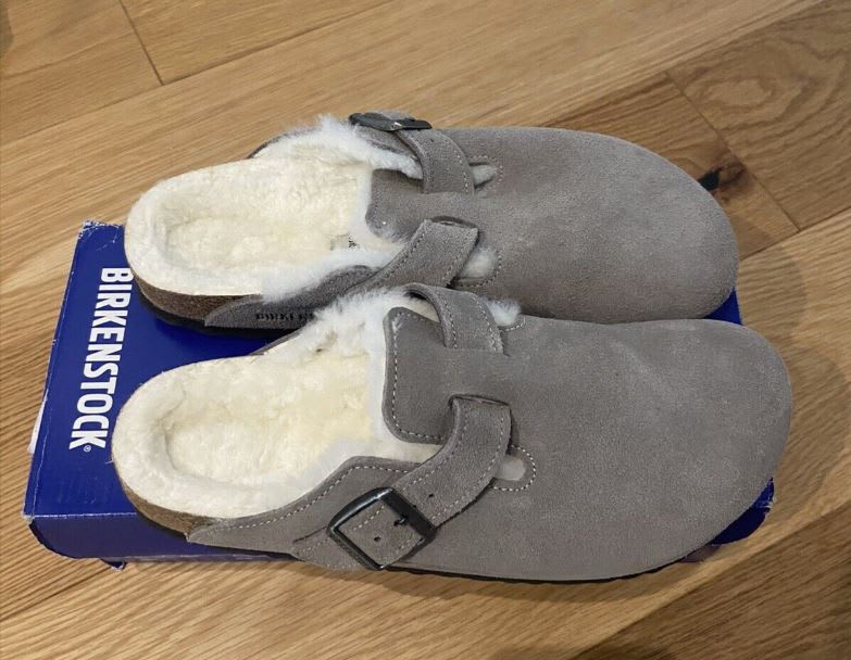 Preloved Birkenstock Bostons sitton on top of their box