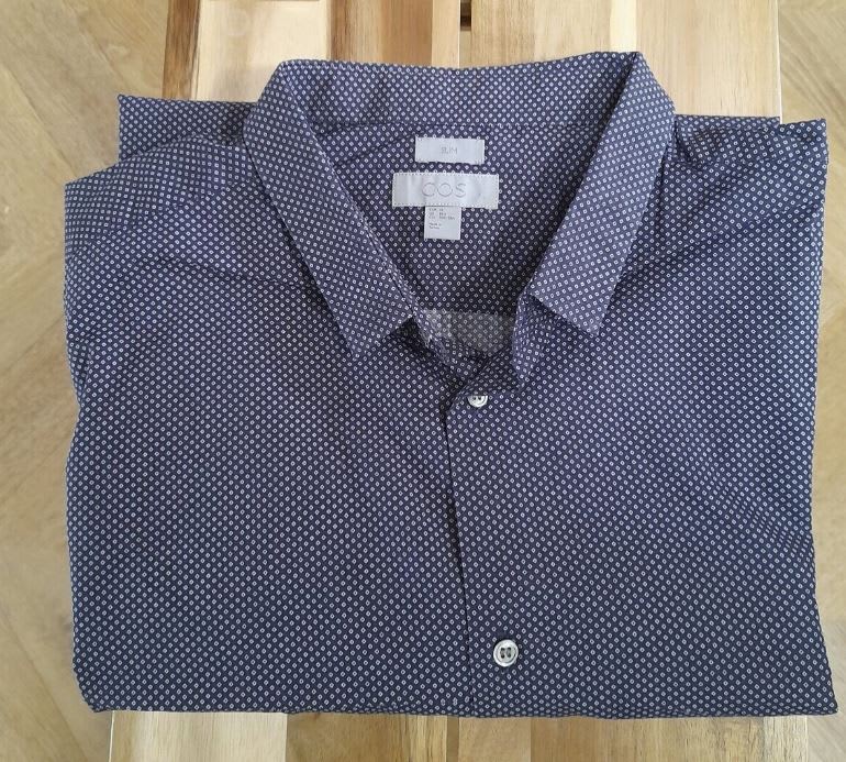 Used COS men's shirt folded