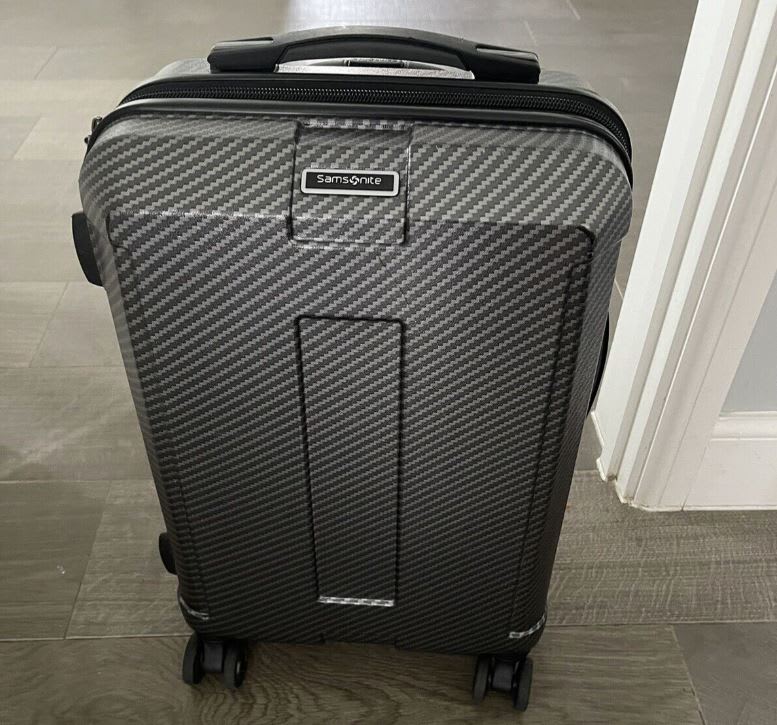 Black and grey checker patterned Samsonite suitcase, second-hand