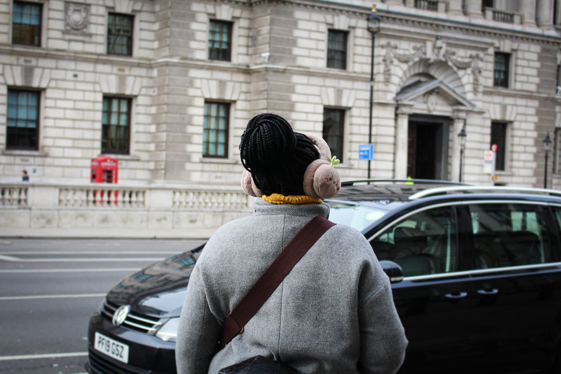 Woman wearing light pink earmuffs