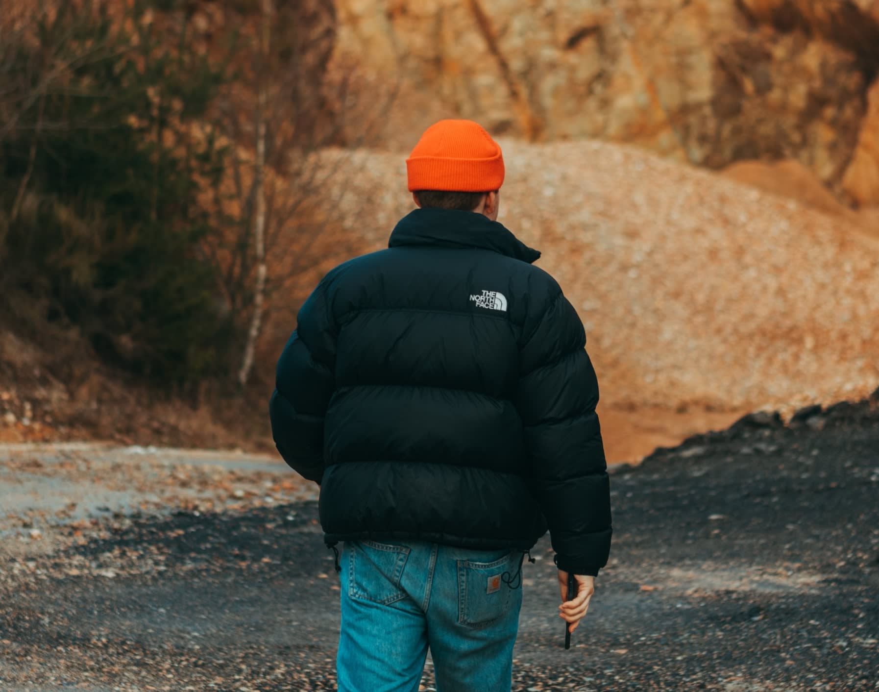 Man wearing a vintage black North Face 'Nupste' puffer