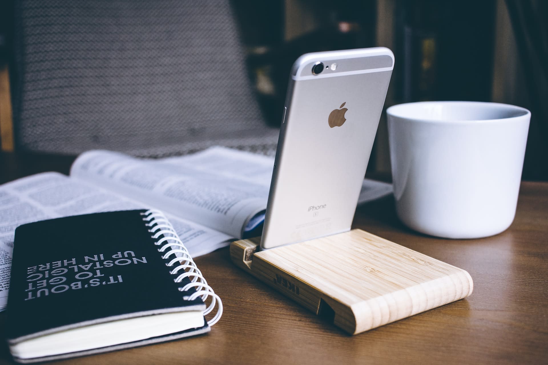 iPhone on a wooden holder