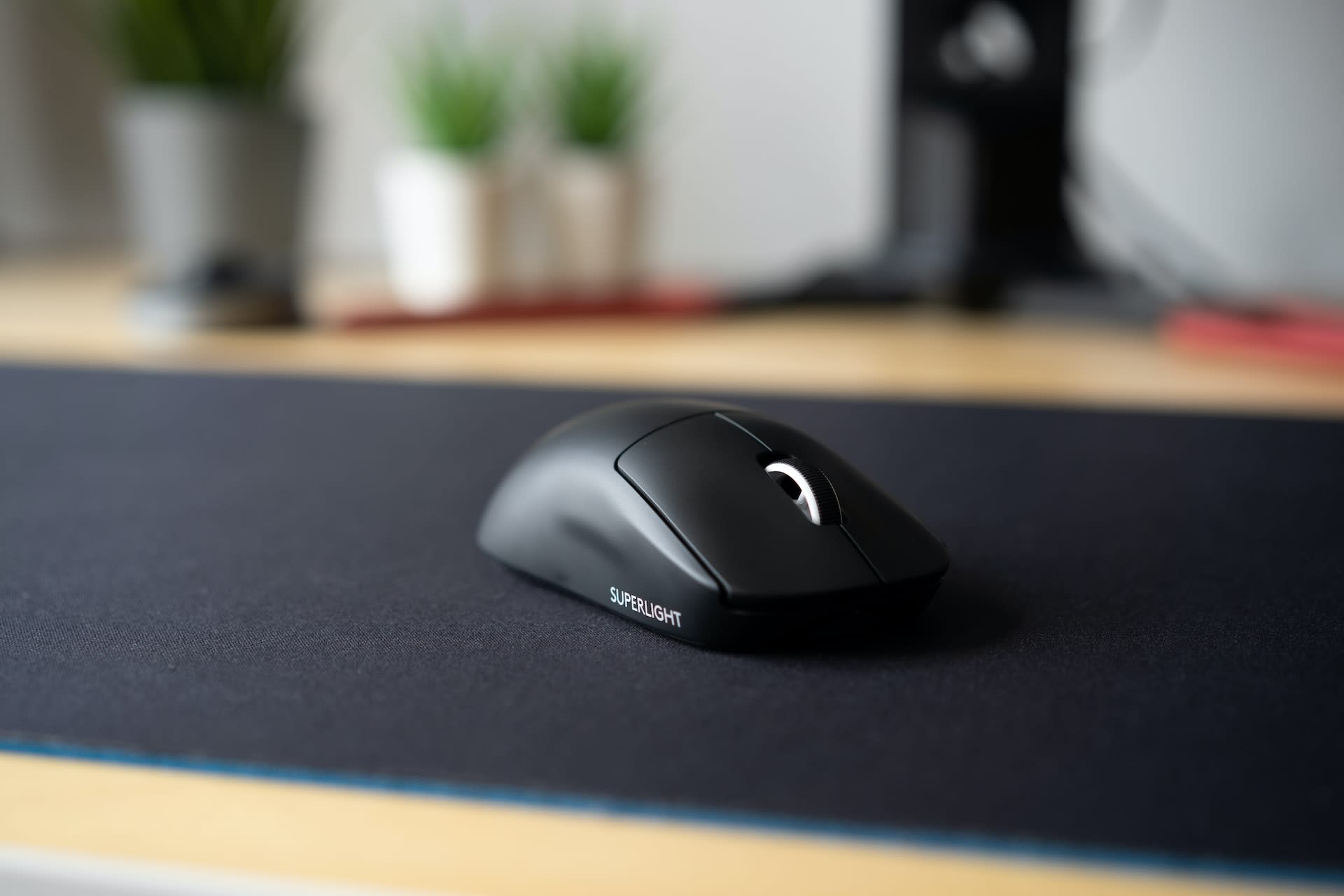 Computer mouse on a black mat