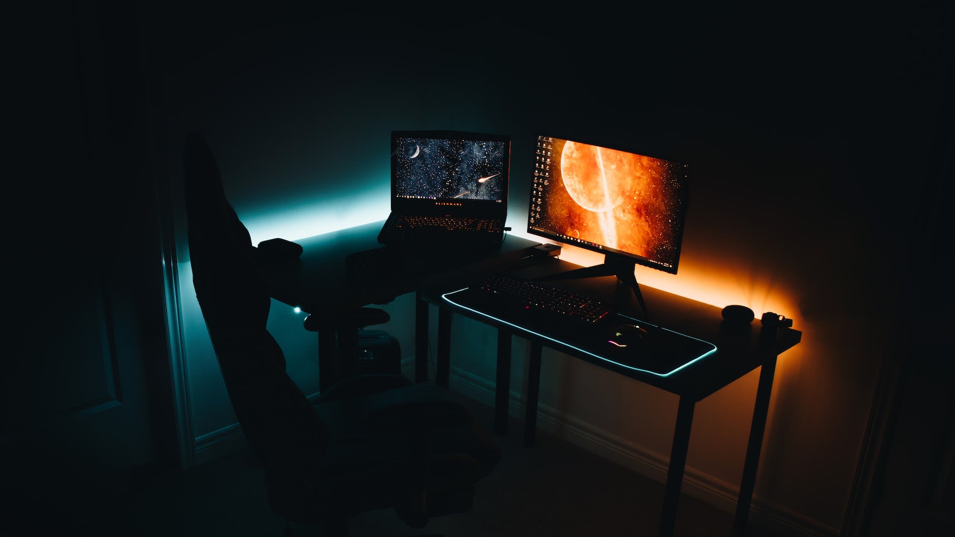 Bedroom desk lit up by LED strip lights