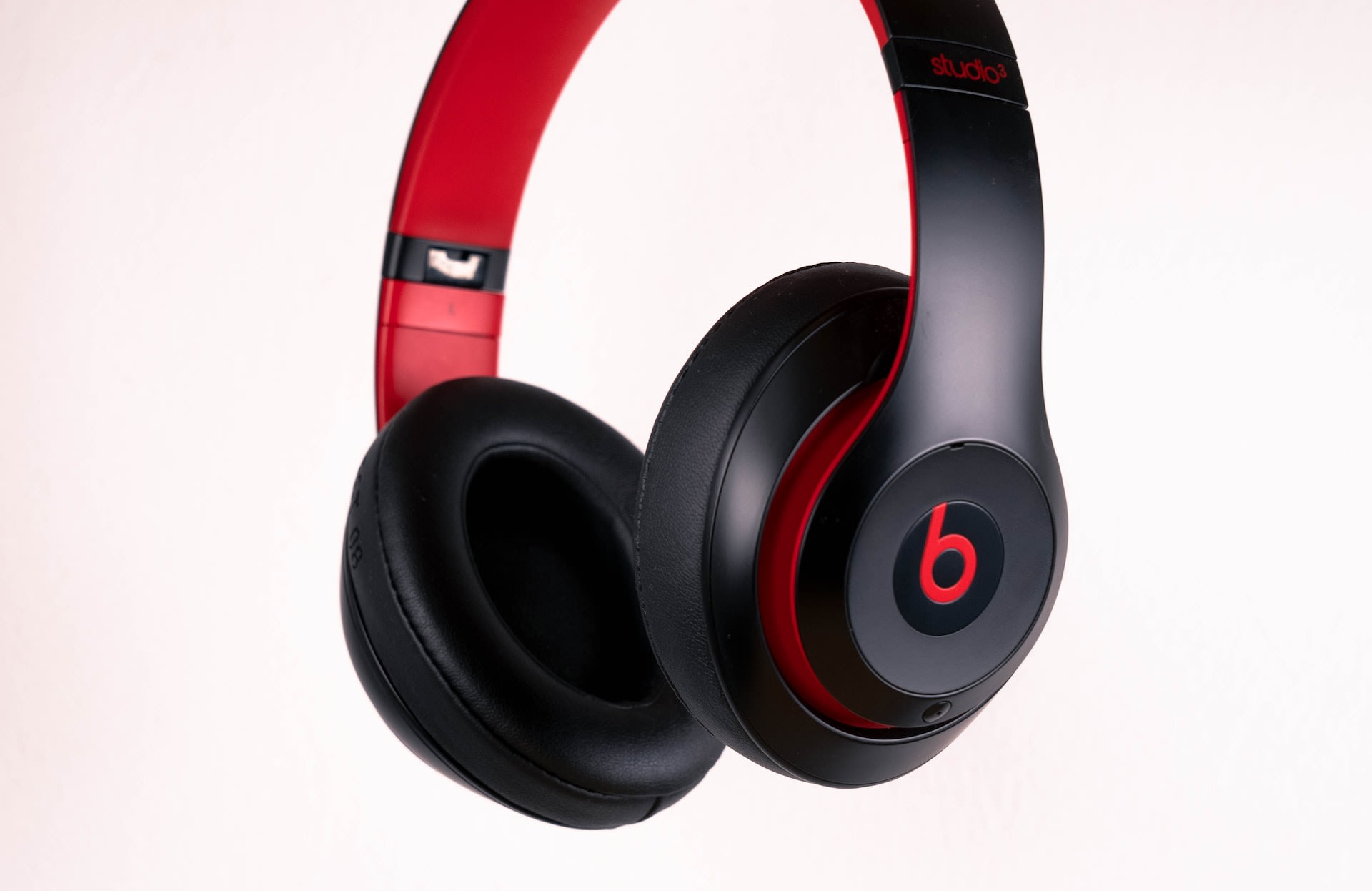 Beats red and black bluetooth headphones