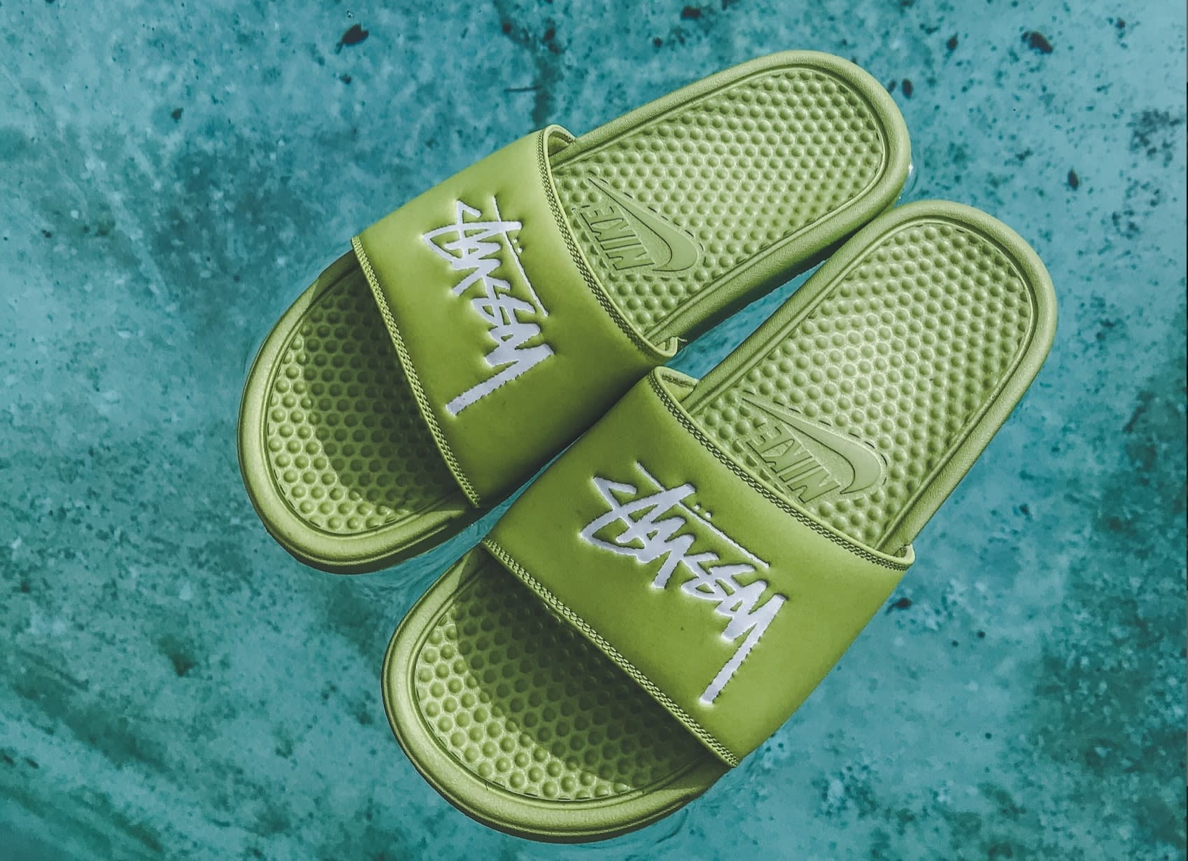 Green Stüssy slides