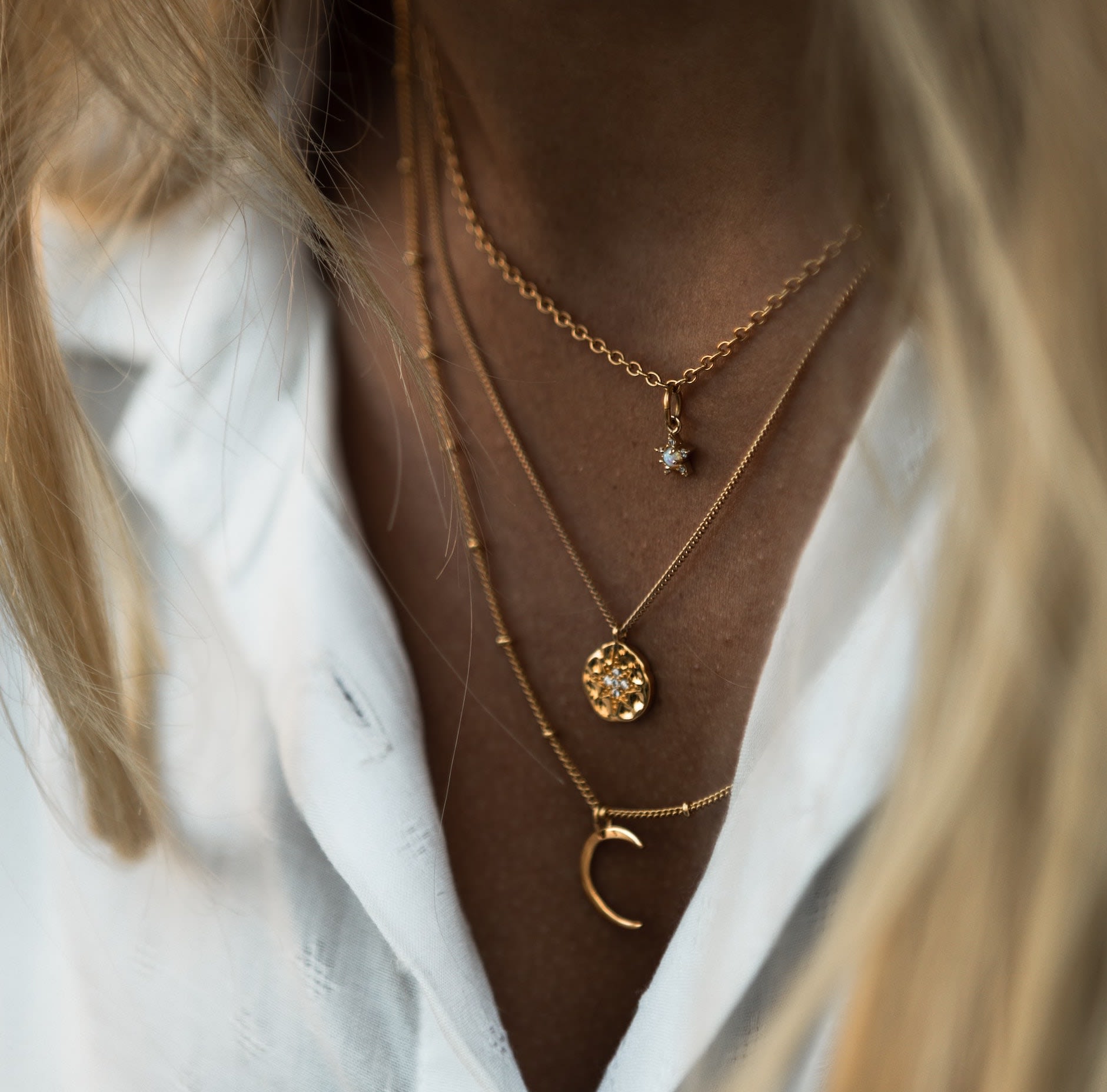 Girl wearing gold necklaces