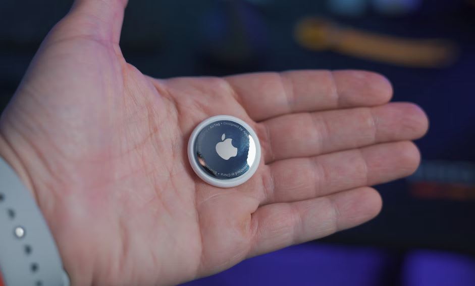 Man holding a second-hand Airtag in his open palm