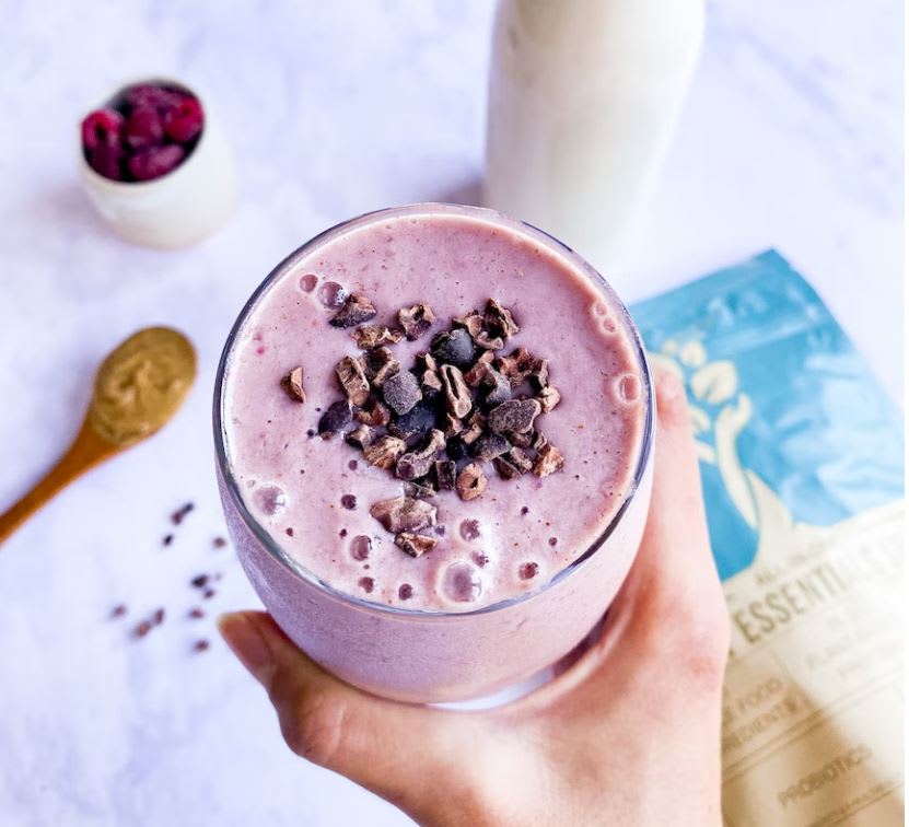 Pink smoothie with cacao nibs on top