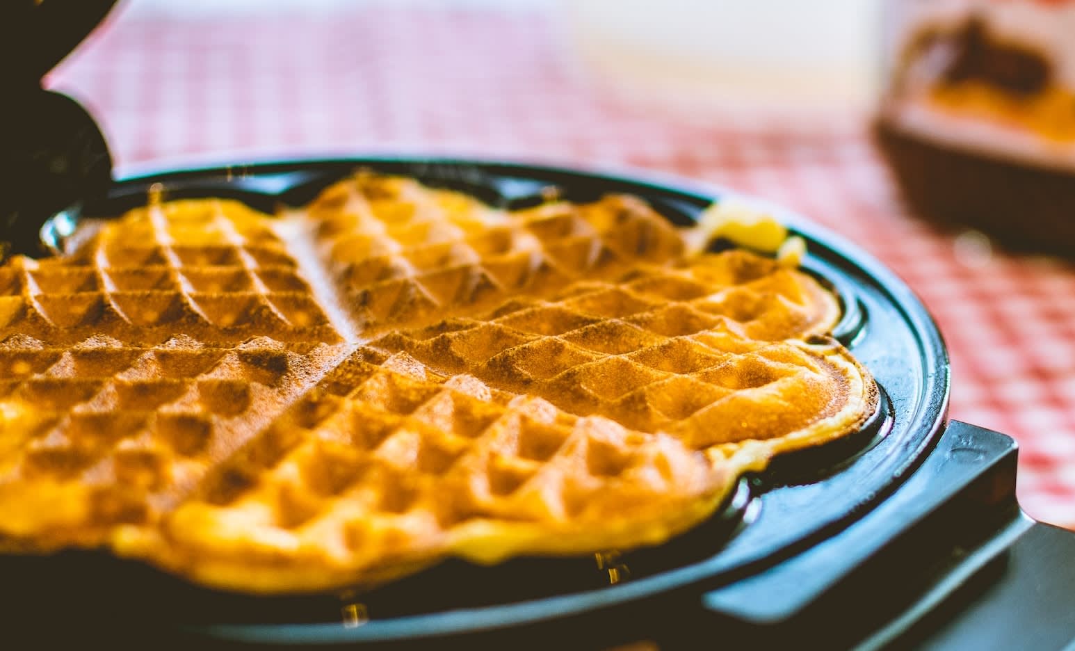 Cooked waffle sitting on the waffle maker