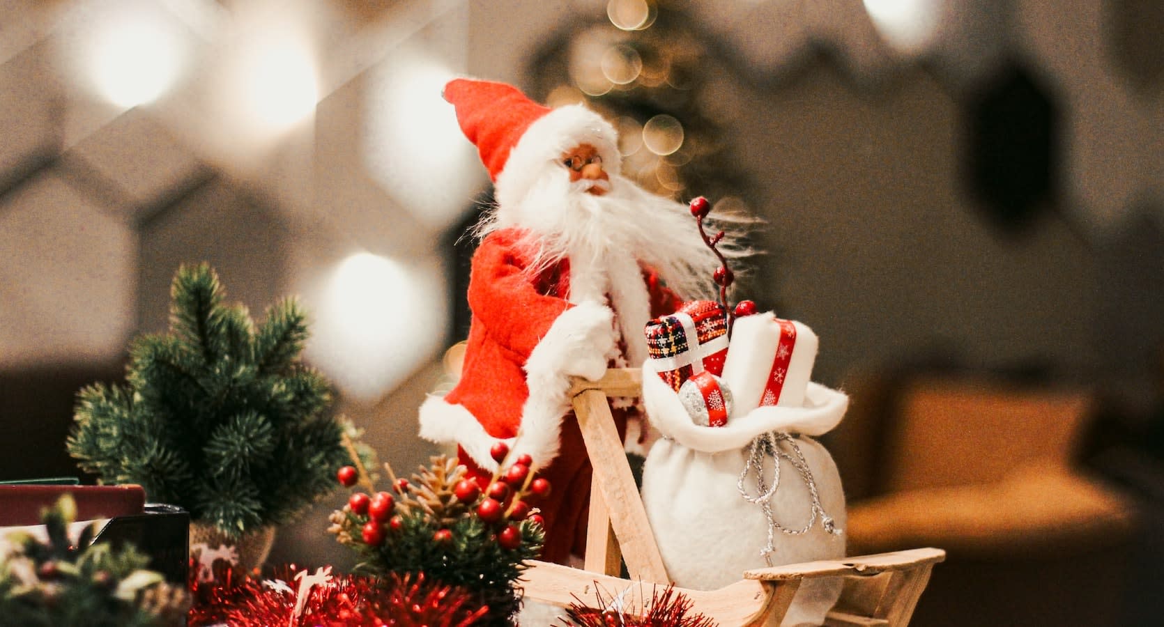 Santa claus figurine on brown wooden chair