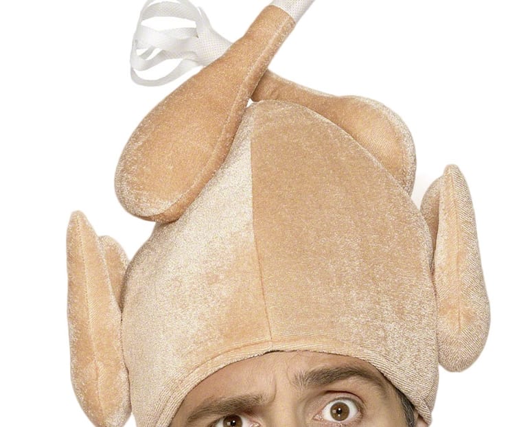 Close up of person wearing turkey hat