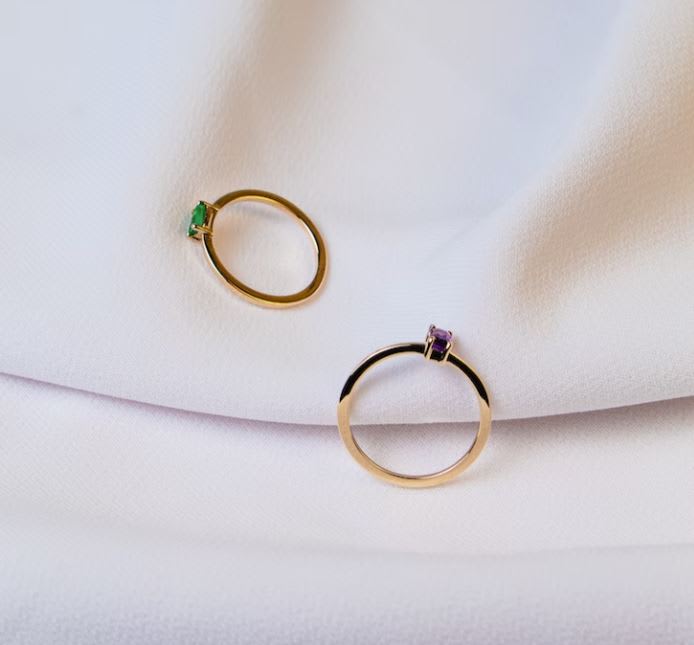 Two gemstone and gold rings