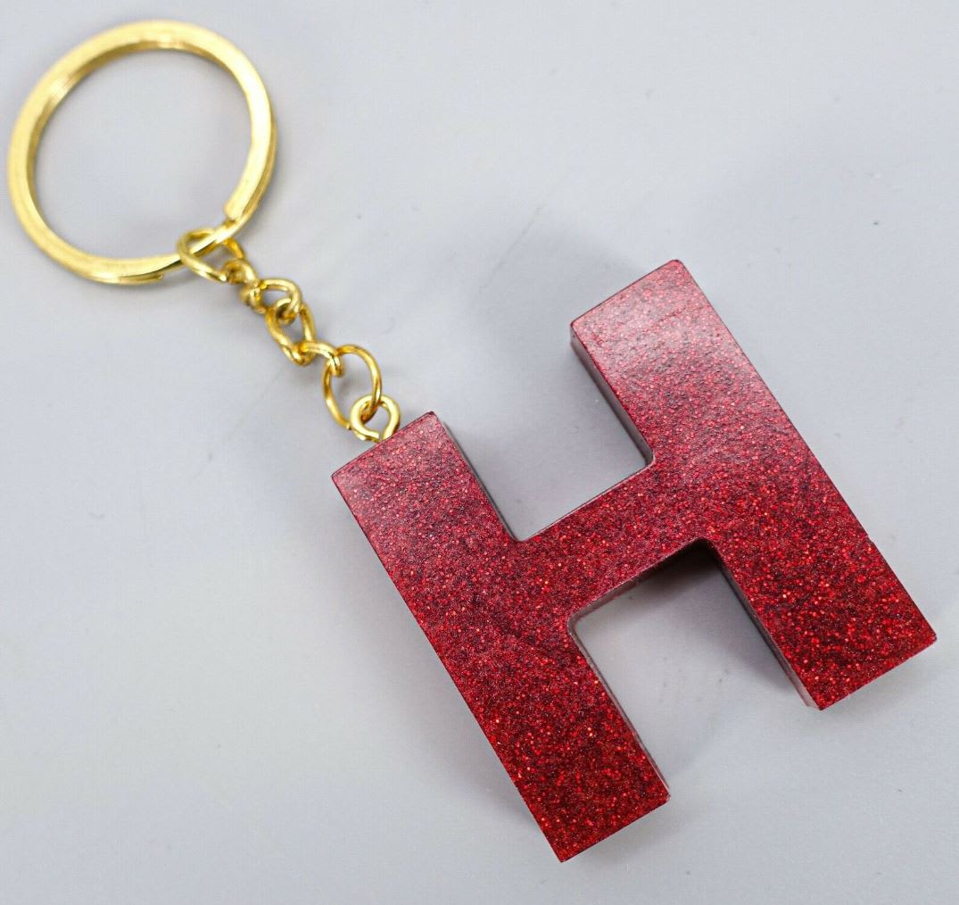 Red letter H keyring on gold chain