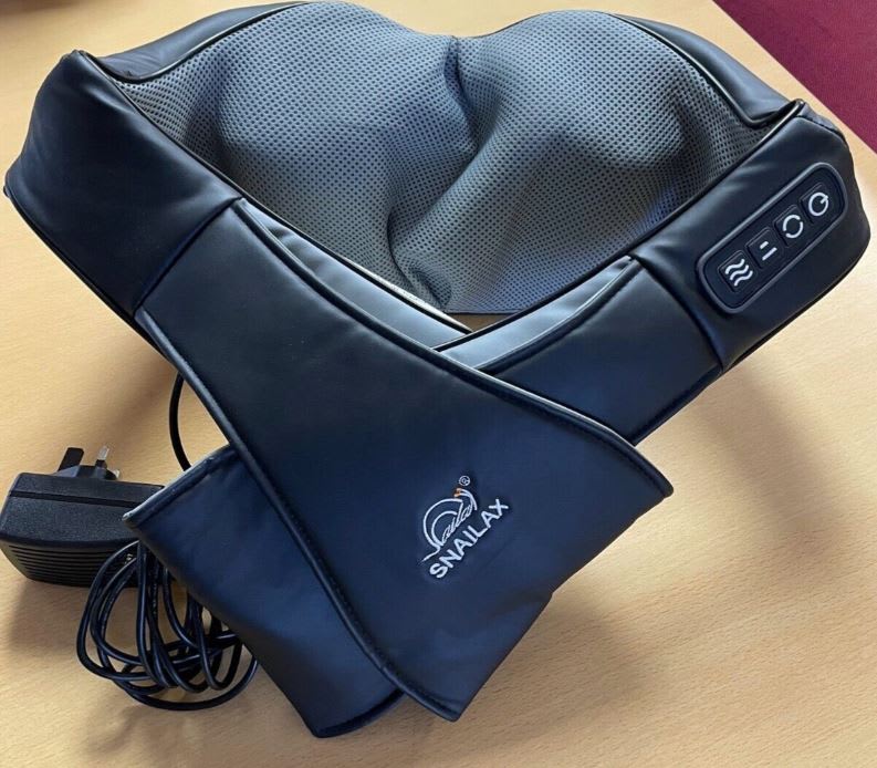 Second hand black back and neck massager on desk