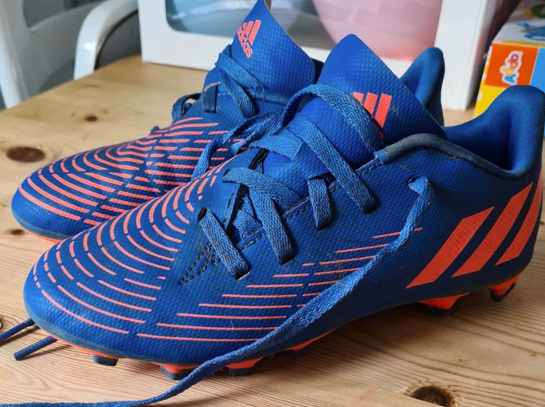 Pair of blue and orange football boots