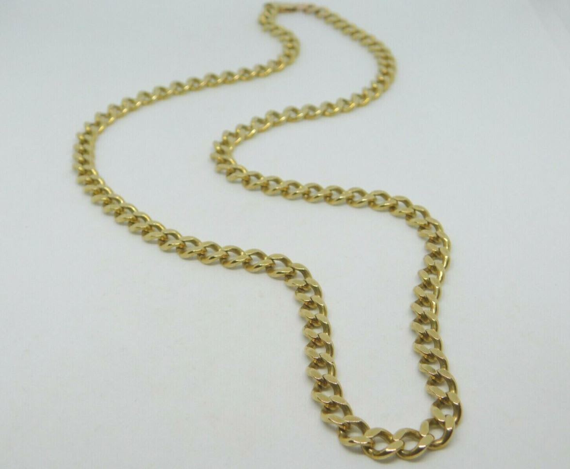 Second-hand men's gold chain flat lay