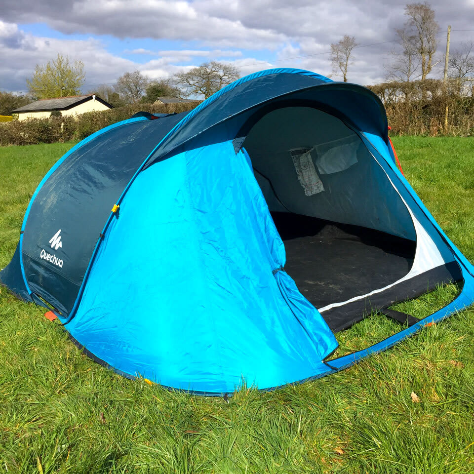 A blue second hand Quechua popup tent