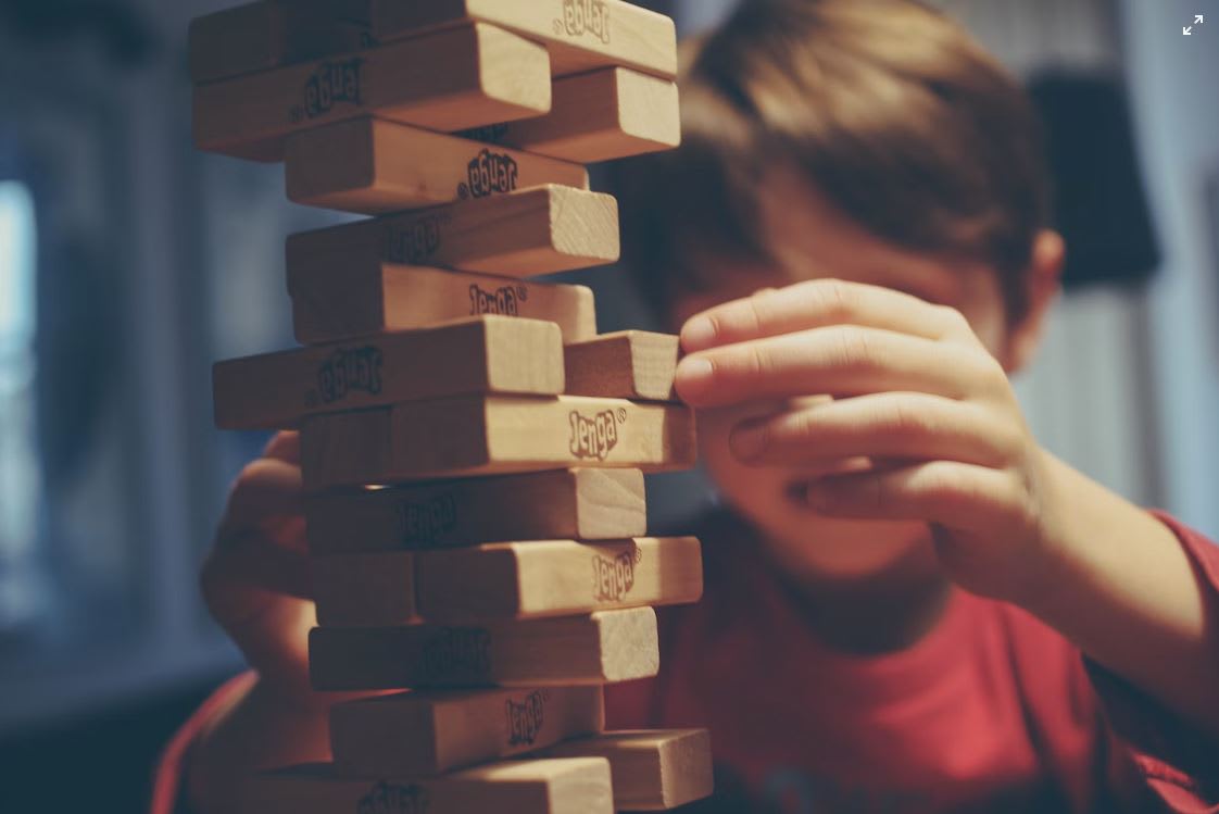 Boy playing Jenga