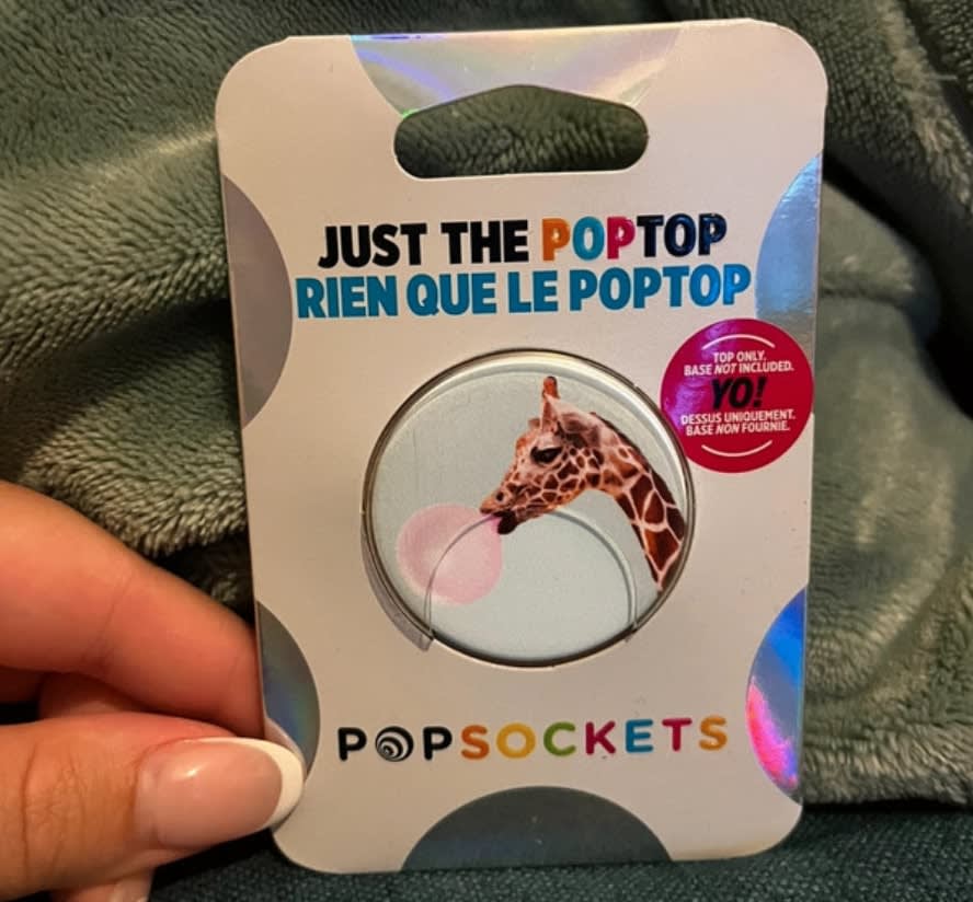 Woman's hand holding second-hand pop socket