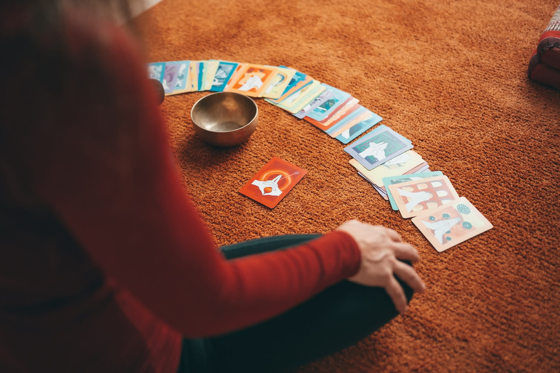 Woman sat with set of affirmation cards