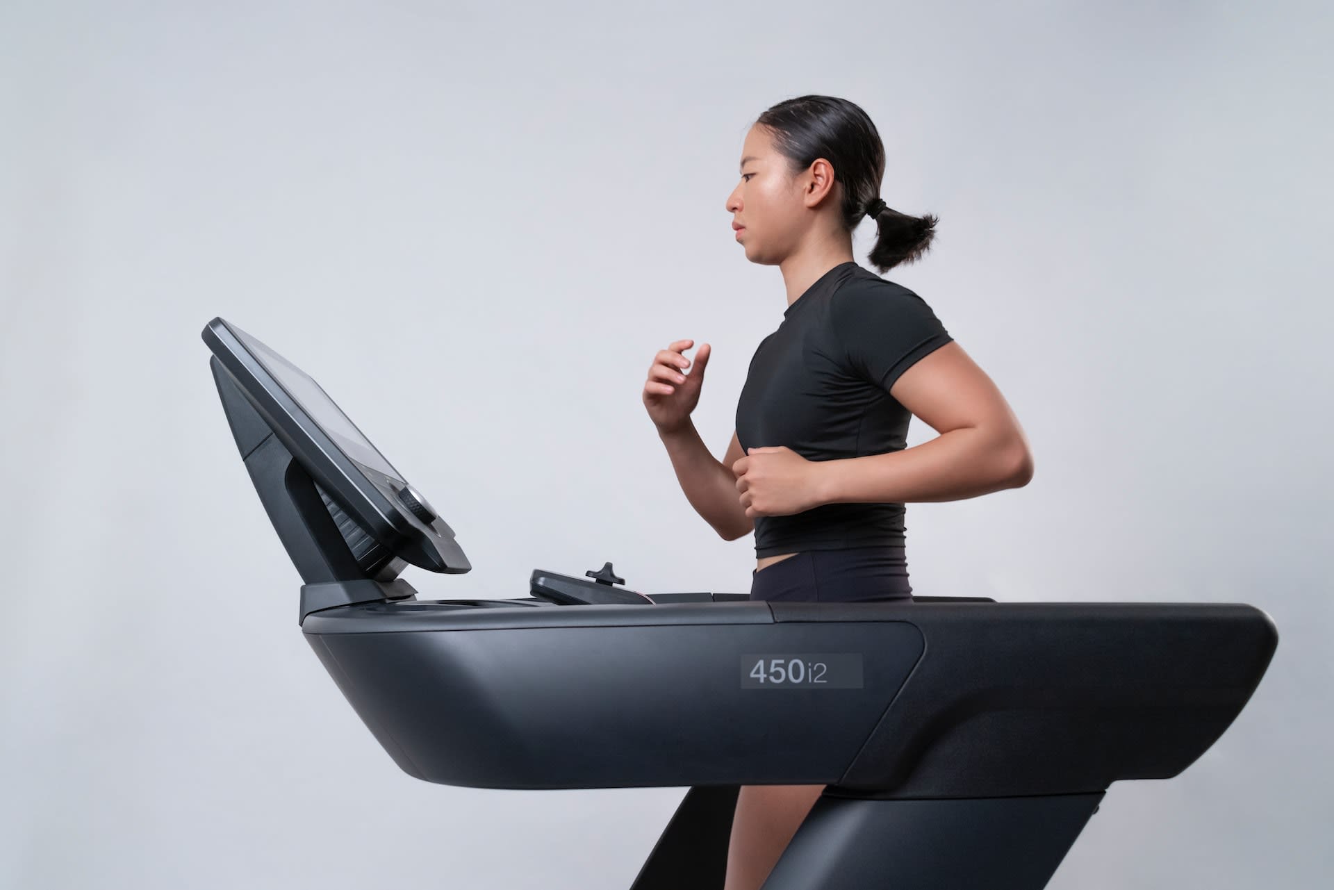 Woman running on home treadmil