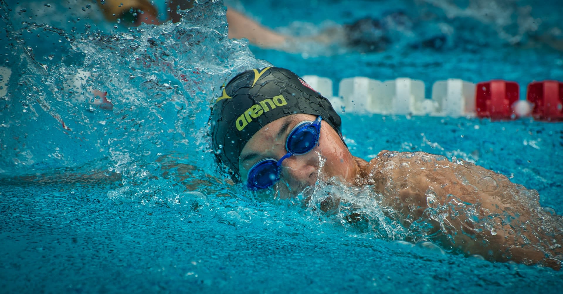 Person wearing a set of used swimming goggles