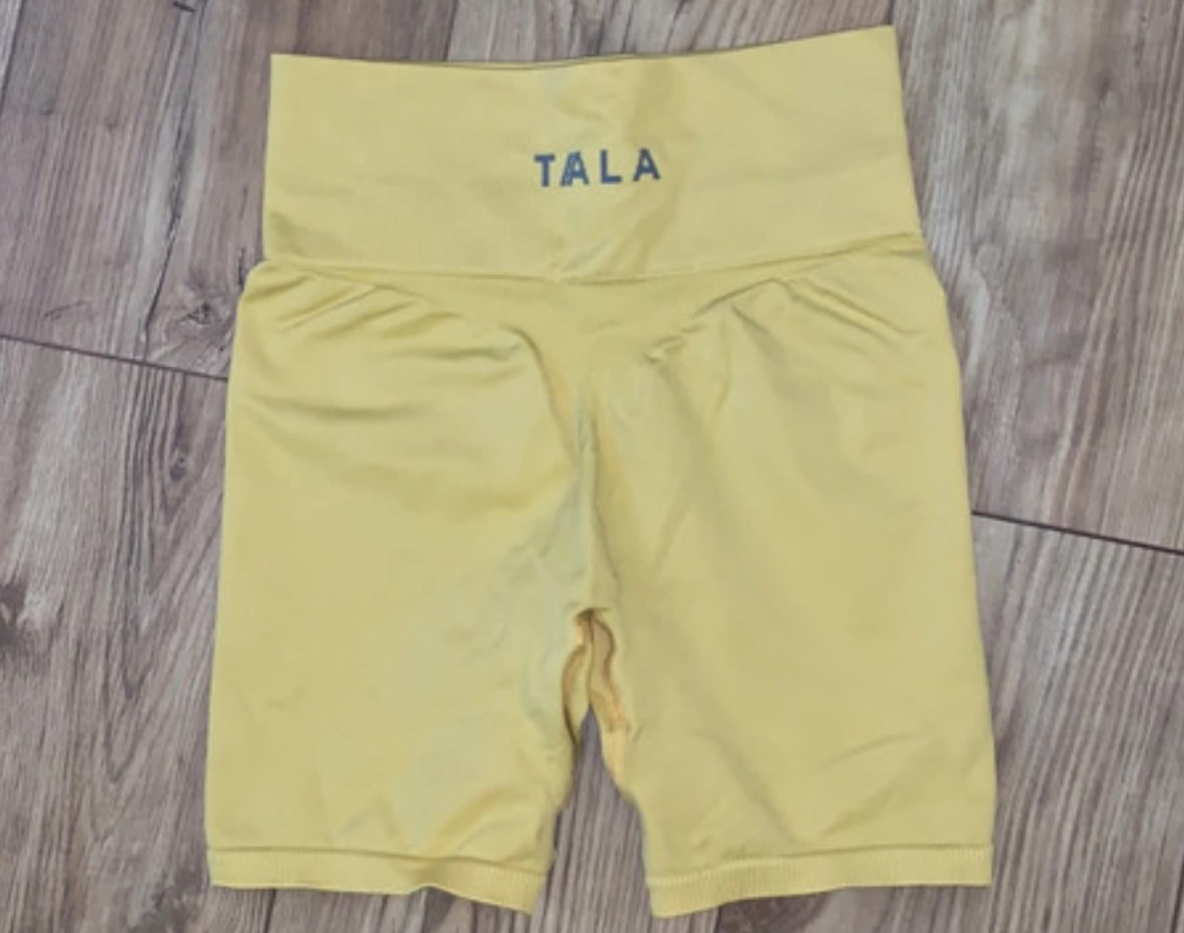 Pair of lemon yellow second hand Tala cycling shorts